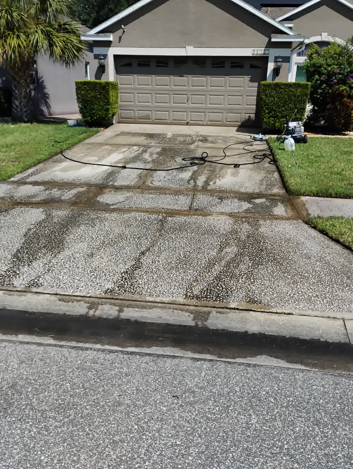 Dirty driveway before professional pressure washing